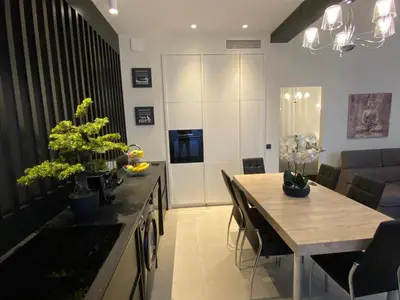 a kitchen and dining room with a table and chairs at ZEN and Charming - Center -5 min walk to Sea- 2BR in Nice