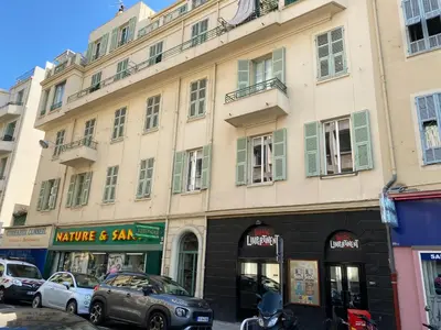 a large building on a city street with cars parked in front at ZEN and Charming - Center -5 min walk to Sea- 2BR in Nice