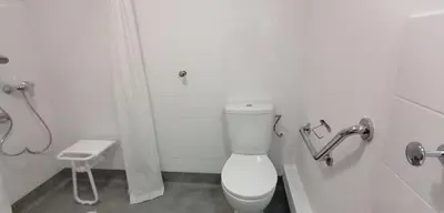 a white bathroom with a toilet and a sink at PARME ETAPE in Nice