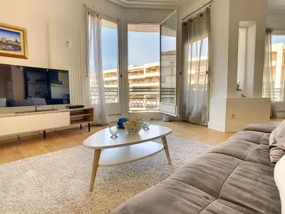 a living room with a couch and a coffee table at Nestor&Jeeves - GLORIA BEACH - Very close sea - Prestigious building in Nice