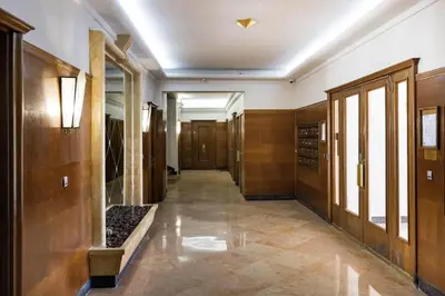 a hallway in a building with wooden walls and a hallway sidx sidx sidx at Sea view - Promenade des Anglais in Nice