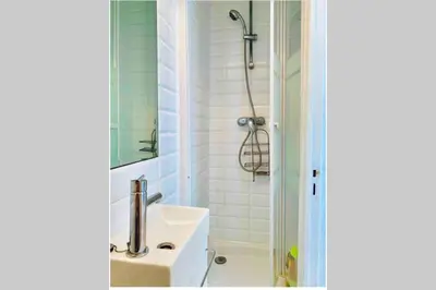 a bathroom with a sink and a shower at Studio on the Attic 3min from the Sea & Main street in Nice