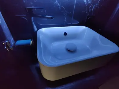 a bathroom with a white sink in a dark room at Legion Suite - Your perfect vacation ! in Nice