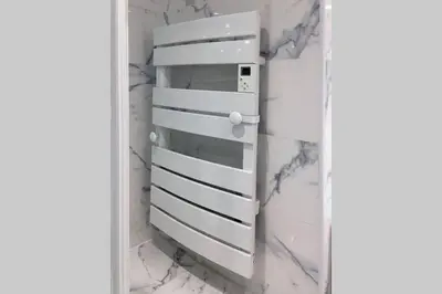 a cabinet in a room with marble walls at Promenade des anglais Amazing sea view 140M2 3BR in Nice