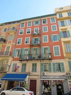 a building with a car parked in front of it at Homelivia, Lovely One bedroom flat Place GARIBALDI et PORT in Nice