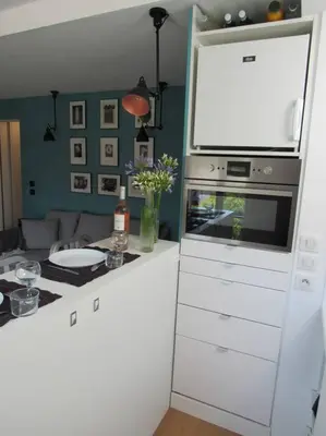 a kitchen with a stove top oven next to a counter at Homelivia, Lovely One bedroom flat Place GARIBALDI et PORT in Nice
