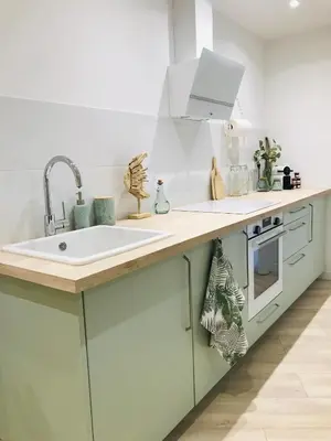 a kitchen with a sink and a stove at Cocon douillet face à la mer de Cagnes sur mer in Cagnes-sur-Mer
