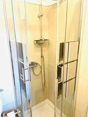a shower with a glass door in a bathroom at Moderne, 2 chambres, 6 Couchages, EASY CHECK-IN in Nice