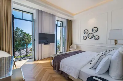 a bedroom with a large bed and a large window at QUAI PROMENADE New Seafront Balcony Air Conditioning in Nice