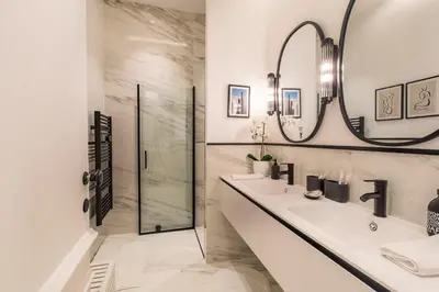 a bathroom with two sinks and a shower at QUAI PROMENADE New Seafront Balcony Air Conditioning in Nice