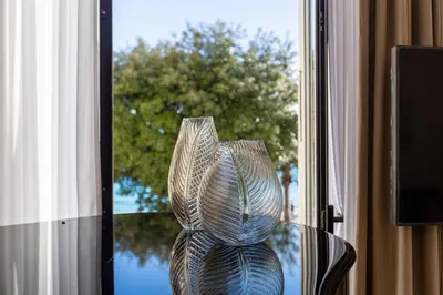 a glass vase sitting on a table in a window at QUAI PROMENADE New Seafront Balcony Air Conditioning in Nice