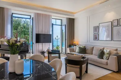 a living room with a couch and a table at QUAI PROMENADE New Seafront Balcony Air Conditioning in Nice