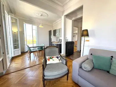 a living room with a couch and a table at ApartHotel Riviera - Hyper Centre Musiciens - Superior 1 Bedroom Apartement AC - Balcony - 10 mn Promenade des Anglais - BALCON PALAIS EXCELSIOR 1 in Nice