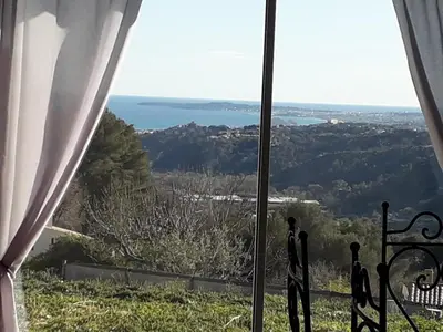 a view of the ocean from a window at Villa Flora in La Gaude