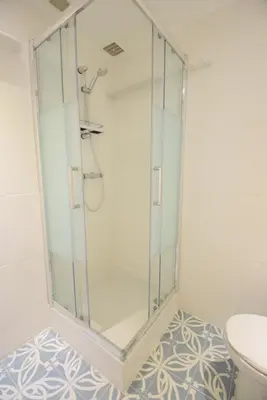 a glass shower in a bathroom with a toilet at Nice Renting - BARILLERIE - COZY LOFT OLD NICE - SEA FRONT - SALEYA - MASSENA in Nice
