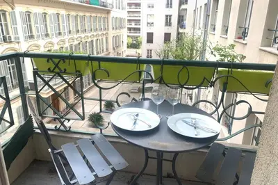 a living room with a couch and a table at Le Lafayette HP in Nice