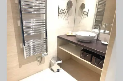 a bathroom with a sink and a mirror at 18 Garibaldi in Nice