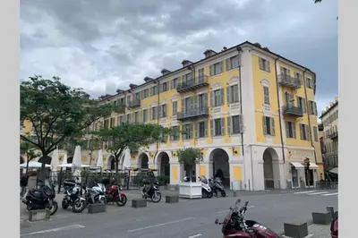 a group of motorcycles parked in front of a yellow building at 18 Garibaldi in Nice