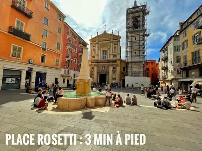a group of people sitting around a fountain in a city at Cosy modern studio in the heart of Nice with AC in Nice