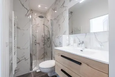a bathroom with a shower and a sink and a toilet at ChezDudi in Nice