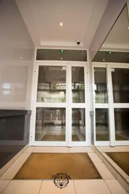 an empty room with a large window in a building at l'Or dans la Mer in Nice