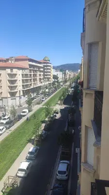 a street with cars parked on the side of a building at Joli Studio - Promenade des Anglais - Accès plage in Nice