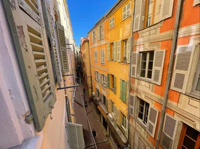 a view of an alley between two buildings at Nice Renting - JAURES - Cosy Flat - Nice old town - Great view - AirCon in Nice