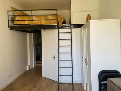 a bunk bed in a room with a ladder at Nice Centre: à 300m de la mer et de la Promenade des Anglais in Nice