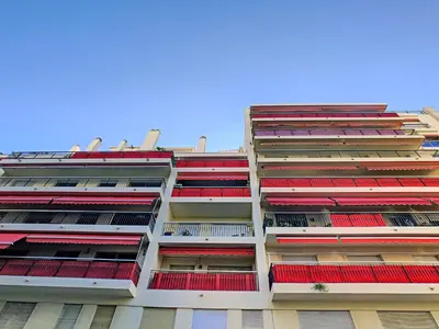 a tall building with red balconies on it at Nestor&Jeeves - SUNRISE TERRACE - Central - Very close sea - Terrace 30m in Nice