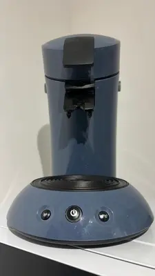 a blue coffee maker sitting on top of a counter at LE MIRAMAR Nice - Clim, Parking, Wifi et piscine in Nice