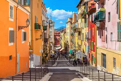 an alley between buildings in an old town at Hotel Aparthotel AMMI Vieux Nice in Nice
