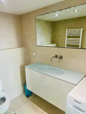 a bathroom with a sink and a toilet and a mirror at Alexandre Mari old town few meters to the beach in Nice