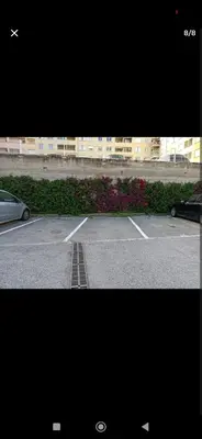 two pictures of a parking lot with a car parked at Grand Studio avec Coin Nuit et Parking in Saint-Laurent-du-Var