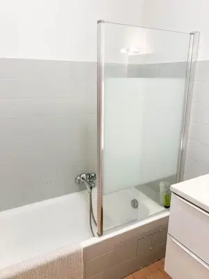 a bathroom with a shower with a white tub at Résidence Le Castille in Nice