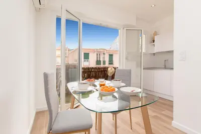 a dining room with a glass table with oranges on it at Maison Bianchi - Herold in Nice