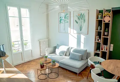 a living room with a couch and a table at La Maioneta Vieux-Nice in Nice