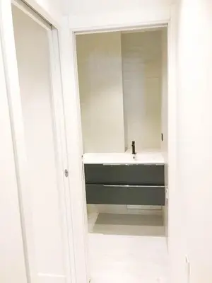 a bathroom with a sink and a mirror at Buffa Résidence in Nice