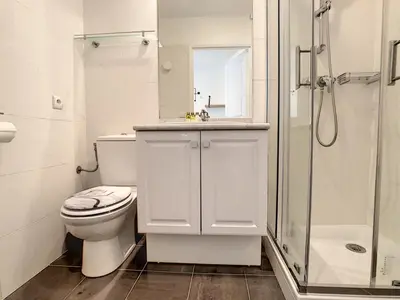 a white bathroom with a toilet and a shower at Nestor&Jeeves - BERLIOZ PATIO - Central - Residential area - Patio 20m in Nice