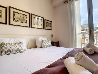 a bedroom with two beds and a window at Nestor&Jeeves - OCEAN PROMENADE - Terrace with sea view - Spacious in Nice