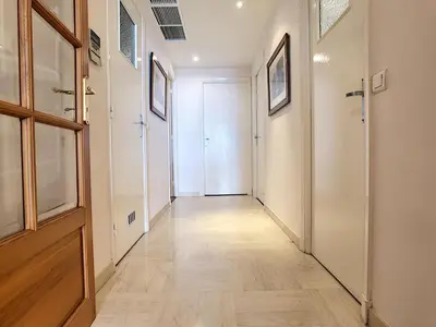 a hallway with a wooden floor and a door at Nestor&Jeeves - OCEAN PROMENADE - Terrace with sea view - Spacious in Nice