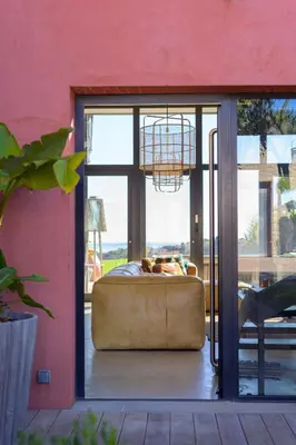 a bedroom with a bed in front of a glass door at Villa de luxe piscine vue mer in Nice