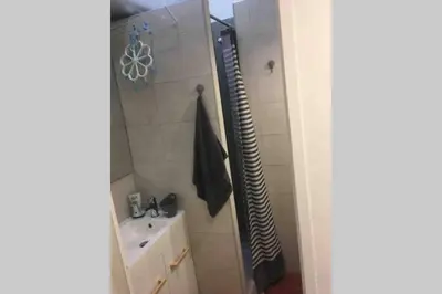 a small bathroom with a sink and a shower at Superbe studio sur Nice in Nice