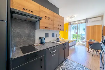 a kitchen with a sink and a counter top at Studio de la plage - Mer, Terrasse et garage in Cagnes-sur-Mer