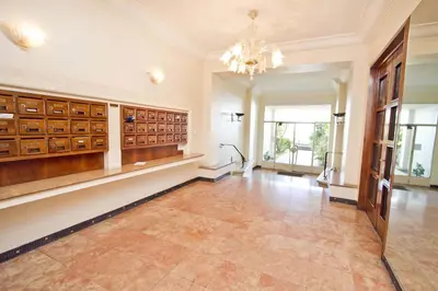 a large hall with a chandelier and a large room at Florida Sea Front in Nice