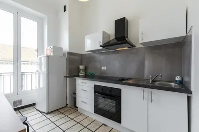 a kitchen with a sink and a stove at FEEL HOME - ASSALIT in Nice