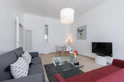 a living room with a couch and a tv at FEEL HOME - ASSALIT in Nice