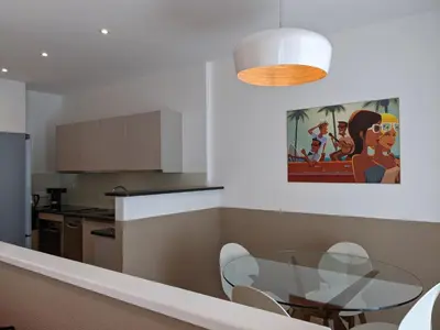 a kitchen with a glass table in a kitchen at Share Inn Appartements in Nice