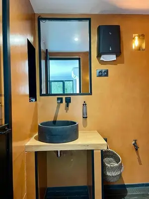 a bathroom with a sink and a mirror at Escondida in Nice
