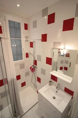 a bathroom with a sink and a shower and a toilet at Red studio Buffa in Nice