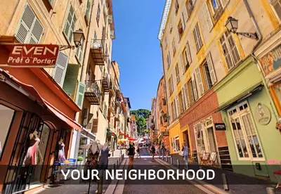 a city street with buildings and people walking down the street at Coeur Vieux Nice - Place Rossetti in Nice